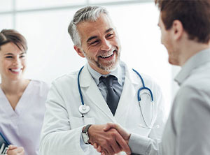 This is a picture of a doctor shaking a persons hand